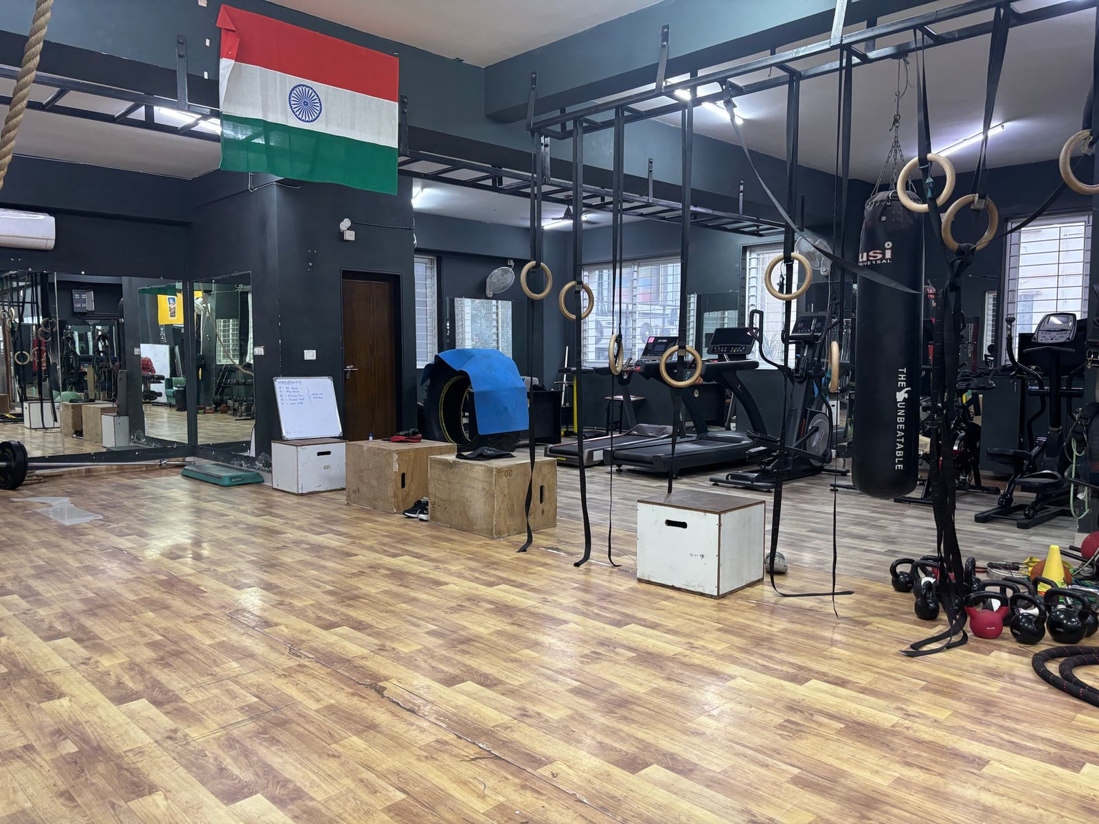 Rings, kettlebells, training rig and open floor at IMFIT’s functional training space